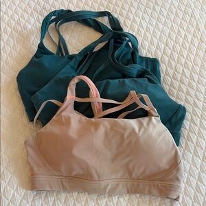 Three Athleta sports bras